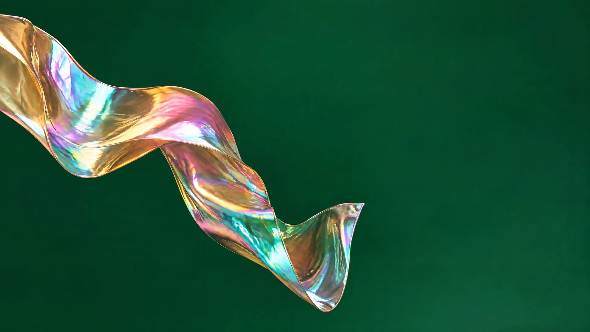 Iridescent foil ribbon twisting across a deep emerald green background
